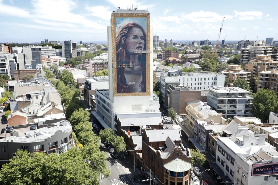 BINGE unravels 18-storey hand painted portrait of Nicole Kidman in Sydney via Thinkerbell
