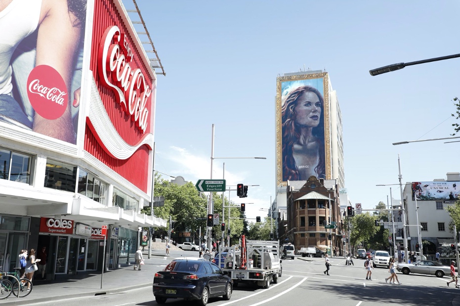 BINGE unravels 18-storey hand painted portrait of Nicole Kidman in Sydney via Thinkerbell