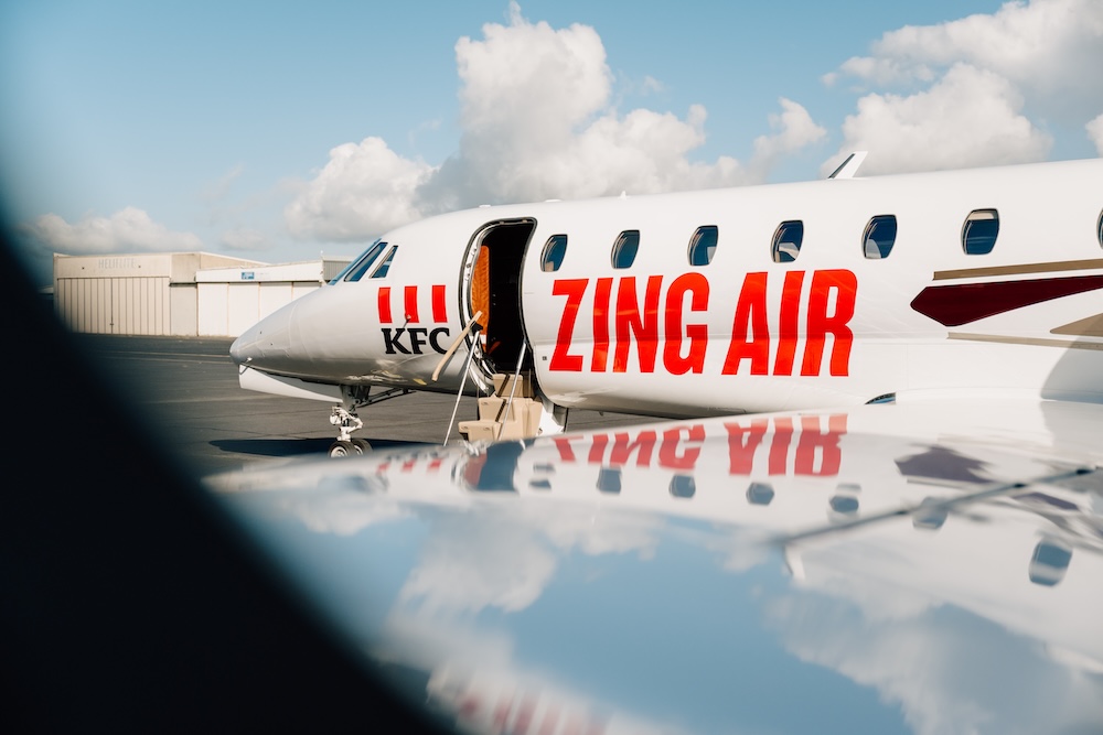 Kiwis take flight on KFC’s first Zing Air flight via Special PR, Stanley St, PHD, Drum and Culture